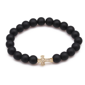 Tiger eye and matte black beaded bracelet featuring a gold plated zircon cross charm