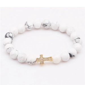Neutral tiger eye beaded bracelet with gold plated zircon cross pendant on white marble beads