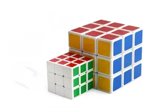 Close-up of two 3x3 speed cubes with white bases and vibrant colored stickers