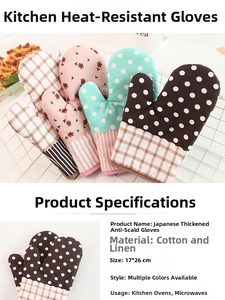 Detail of checkered cotton linen oven mitts in a white wire basket for kitchen use
