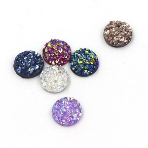 Close-up of 8mm resin druzy cabochons in various colors for jewelry making accessories