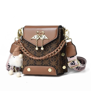 Vintage brown monogram crossbody bag with golden swan clasp and pearl tassels for women