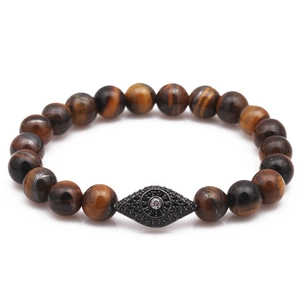 Natural tiger's eye beaded bracelet with a black zircon evil eye charm in gold plating