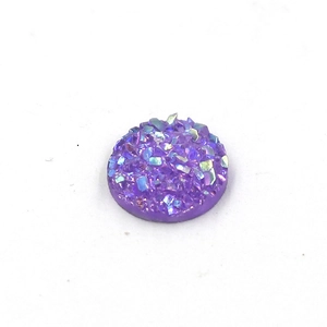 Macro shot of 8mm purple resin druzy stone with sparkling texture and round shape