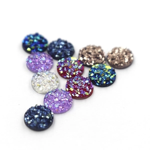 Macro shot of 8mm colorful resin drusy cabochons with sparkling glitter texture