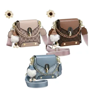 Detail of crossbody bag colors with vintage geometric pattern and branded wide strap