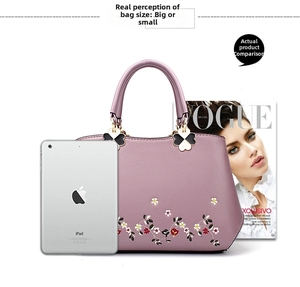 Lavender handbag size reference with iPad and Vogue magazine showing daily capacity