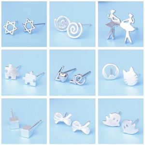 Collection of minimalist silver stud earrings in nine diverse geometric and fun shapes