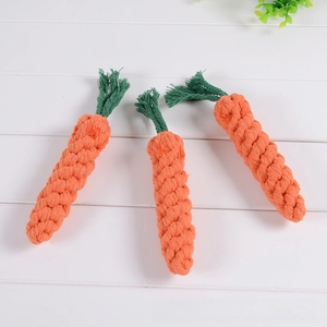 Three handmade cotton rope carrot toys for dogs with durable woven texture and vivid colors