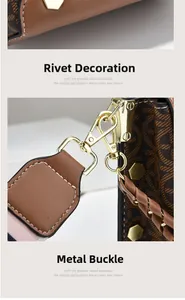 Detail of brown geometric pattern leather bag with gold rivets and spring clasp
