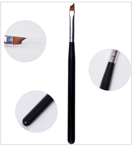 Macro detail of the angled nail art brush with synthetic bristles and black matte handle