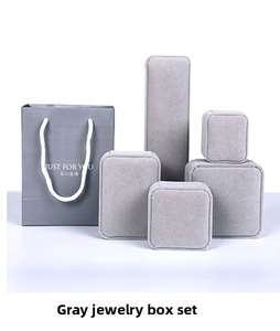 Detailed set of premium grey velvet jewelry gift boxes with matching paper carry bag