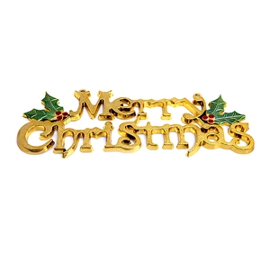 Golden Merry Christmas sign ornament with green leaves and red berries for holiday trees