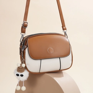Fashionable two-tone brown and beige PU leather crossbody bag with cute monster keychain