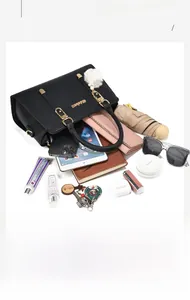 Top view of spacious black leather tote bag showcasing its large capacity for daily items
