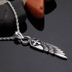 Silver stainless steel angel wing necklace with a small crystal-inlaid cross pendant