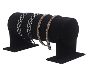 Detail view of black velvet headband display stand with sparkling rhinestone hair hoops