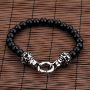 Men's punk skull bracelet with polished black onyx beads and silver steel connector
