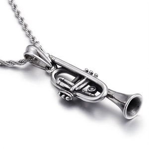 Vintage silver trumpet pendant necklace with twisted chain on a white background