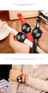Lifestyle view of women's quartz watch with colored dial and textured leather straps