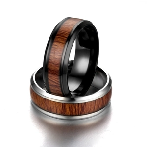 Detail of wood grain inlay on black and silver titanium steel rings for men