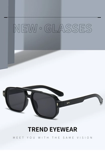 Detail view of square pilot sunglasses with black frame and gold rivet accents