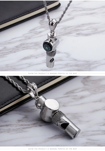 Detailed view of silver stainless steel whistle pendant necklace with built-in compass