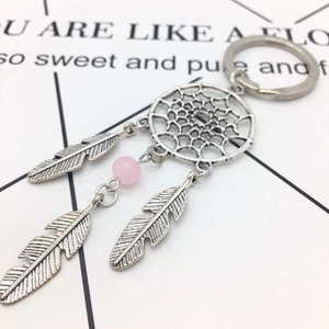 Bohemian alloy dreamcatcher keychain featuring metal feather charms and a pink bead