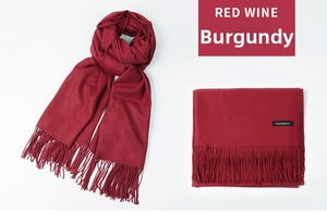 Detail of red wine cashmere scarf featuring soft texture and elegant fringe edges