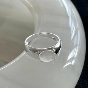 Minimalist 925 sterling silver open ring with an oval white crystal in a four-claw setting