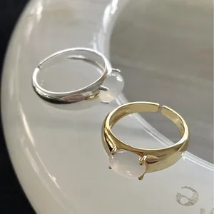 Minimalist adjustable 925 silver and gold rings set with smooth white crystal stones
