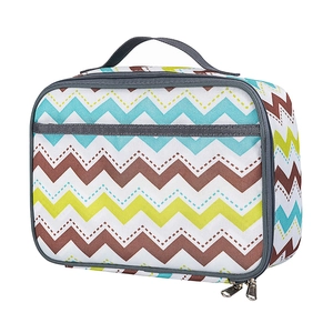 Detail shot of blue zigzag oxford fabric lunch bag with sturdy dual metal zippers