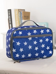 Close-up of blue star pattern oxford thermal lunch bag with sturdy webbing handles