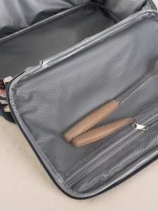 Detail view of lunch bag interior with grey mesh pocket and silver metal zipper compartment