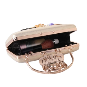 Champagne gold evening clutch bag with 3D floral accents and spacious inner compartment