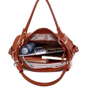 Brown faux leather tote bag with large capacity showing interior storage and ring detail