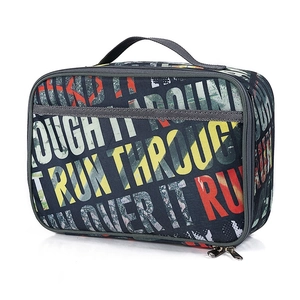 Detail of blue camo oxford lunch bag showing sturdy dual zippers and reinforced handle