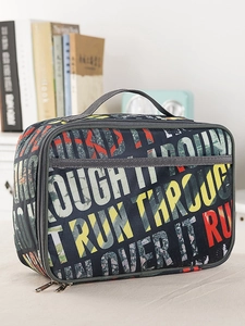 Detailed view of insulated lunch bag with blue graffiti pattern and durable zippers