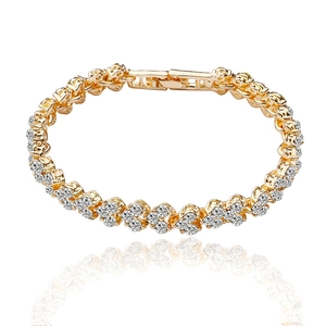 Elegant gold bracelet with clover leaf cubic zirconia charms on white background