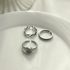 Set of three vintage S925 sterling silver open rings with adjustable braided and seal designs