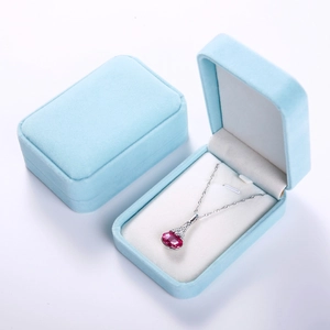 Detail view of sky blue velvet necklace gift box showing open and closed rectangular design