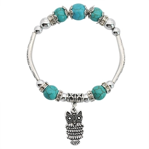 Bohemian turquoise beaded bracelet with silver owl charm and vintage ethnic style elements