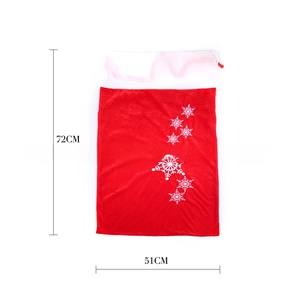 Detailed view of red and white velvet Christmas gift bag with snowflakes, size 72x51cm