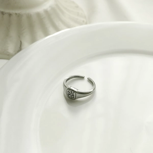 Retro S925 sterling silver adjustable signet ring with vintage pattern on white background