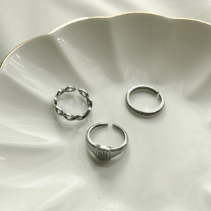 Macro shot of S925 sterling silver vintage rings with Fu character and geometric textures