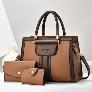 Three-piece women's shoulder bag set in brown pebbled leather with a crossbody strap