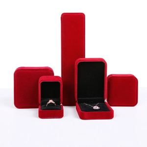 Detailed assortment of red velvet jewelry boxes for rings, necklaces and bracelets