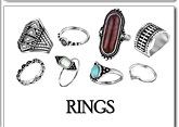 Detail of vintage silver boho rings set featuring red and blue gemstone accents