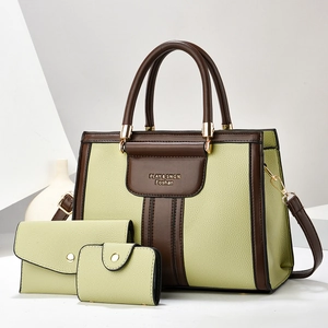 Three-piece tote bag set in light green and brown leather with elegant gold hardware