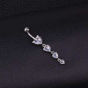 Silver belly button ring with sparkling heart zircon pendants on black leather texture